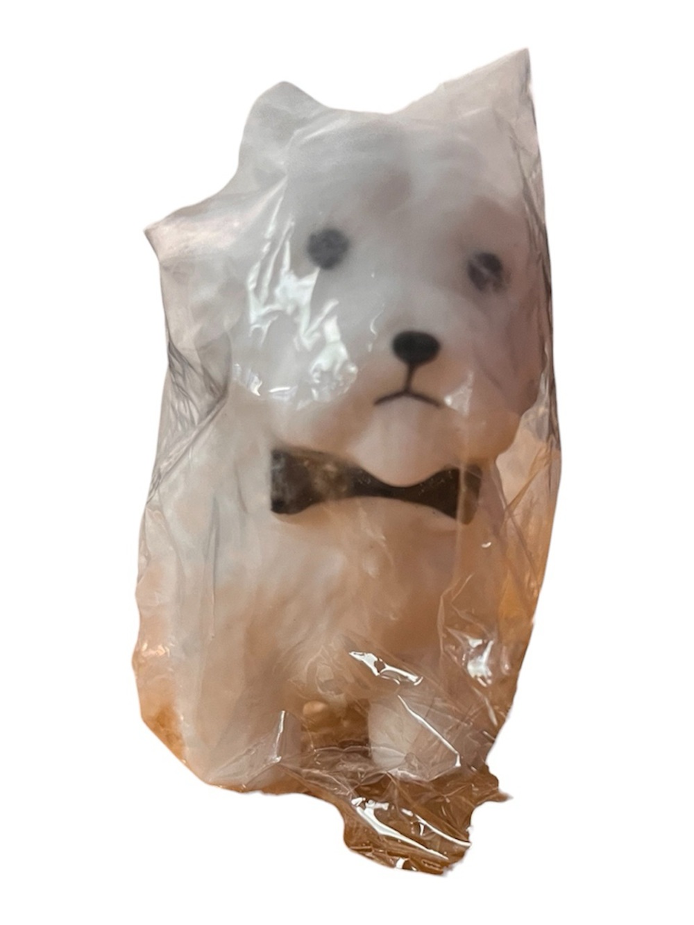 White crunchy squishy dog with bow